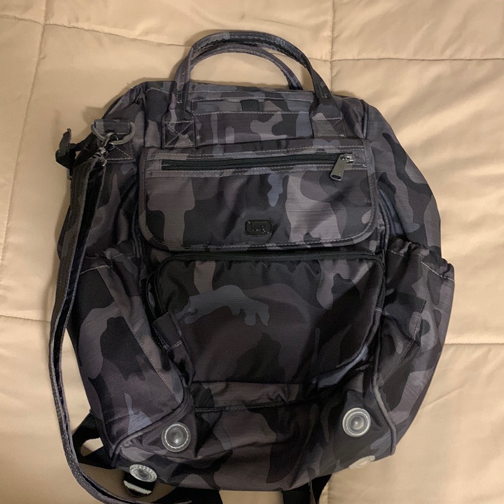 Dark camo lug via backpack